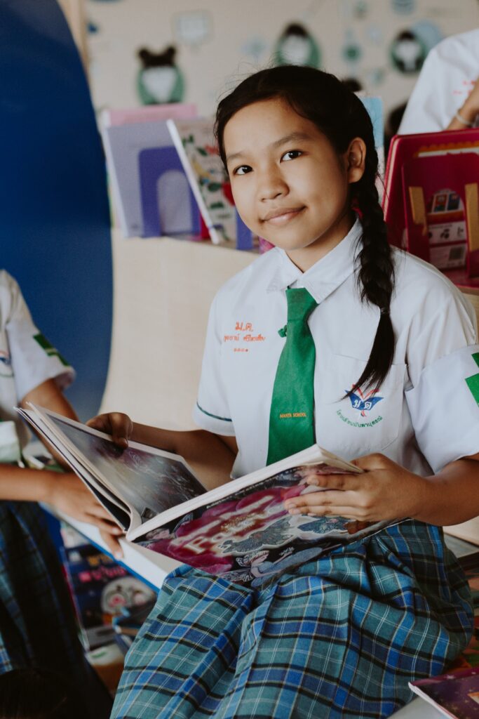 A Female Student Reading a Book