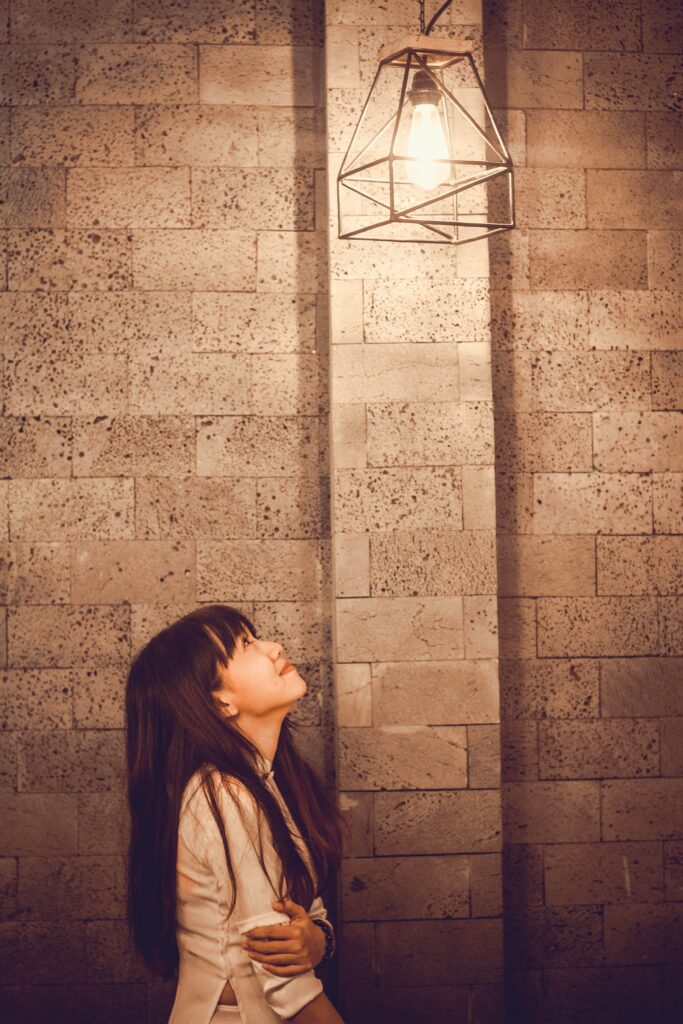 Girl Looking at Lightbulb